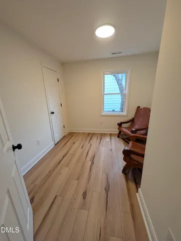 a bathroom with a double vanity sink mirror and bathtub