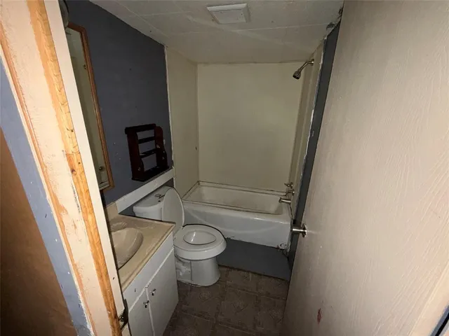 a bathroom with a sink and toilet