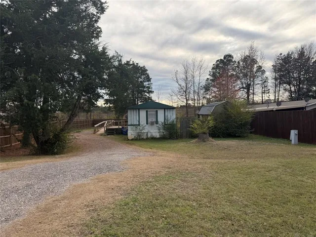 a house with trees in the background