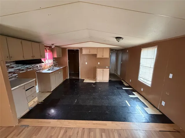 a kitchen with a sink and cabinets