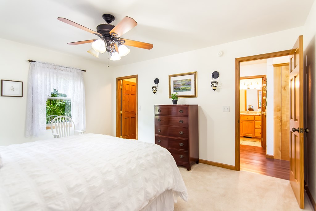 111 Trophy Buck Point Murphy, NC 28906 - Photo 27 of 51 a bedroom with a bed and a chandelier