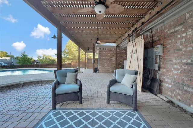 a outdoor living space with furniture and garden view