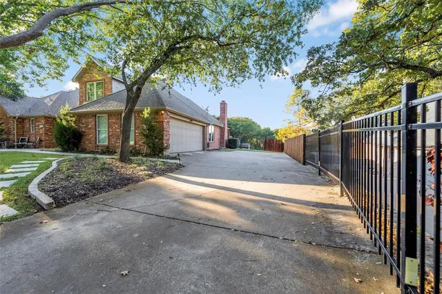a view of a house with a tree in front of it
