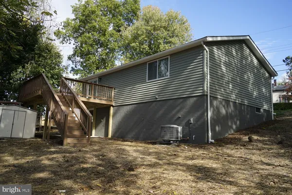 a house with trees in the background