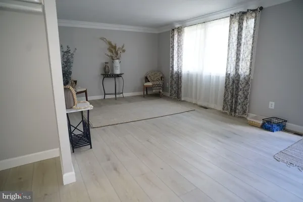 a view of livingroom with furniture and windows