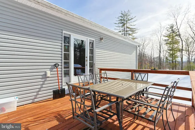 a outdoor space with the couches and a potted plant