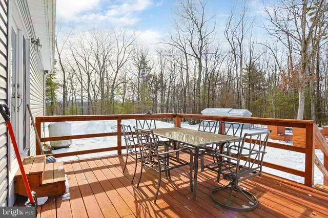 a view of a swimming pool with an outdoor seating