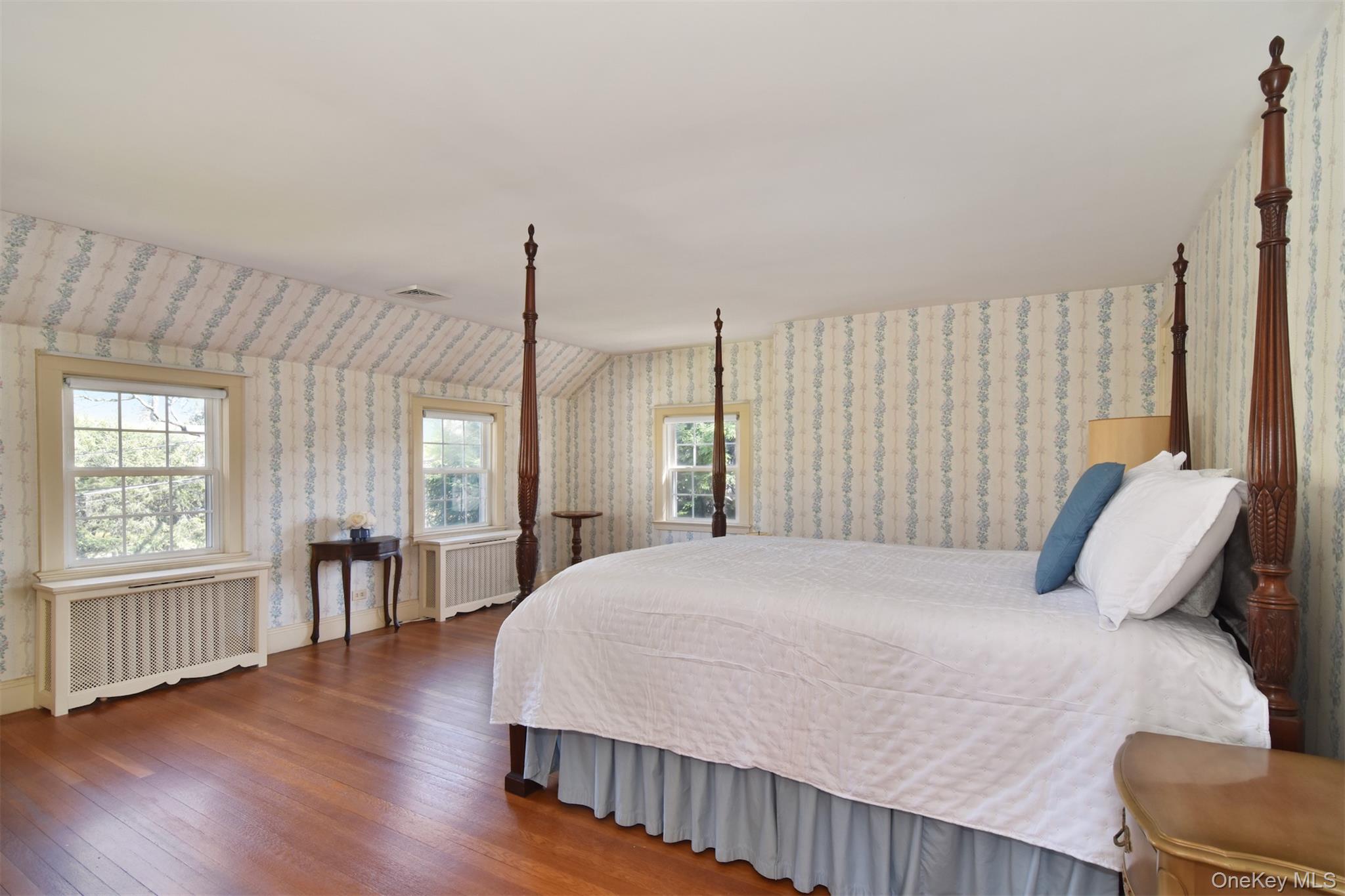 22 Burkewood Road Mount Vernon, NY 10552 - Photo 16 of 27 a bedroom with a large bed and a chair