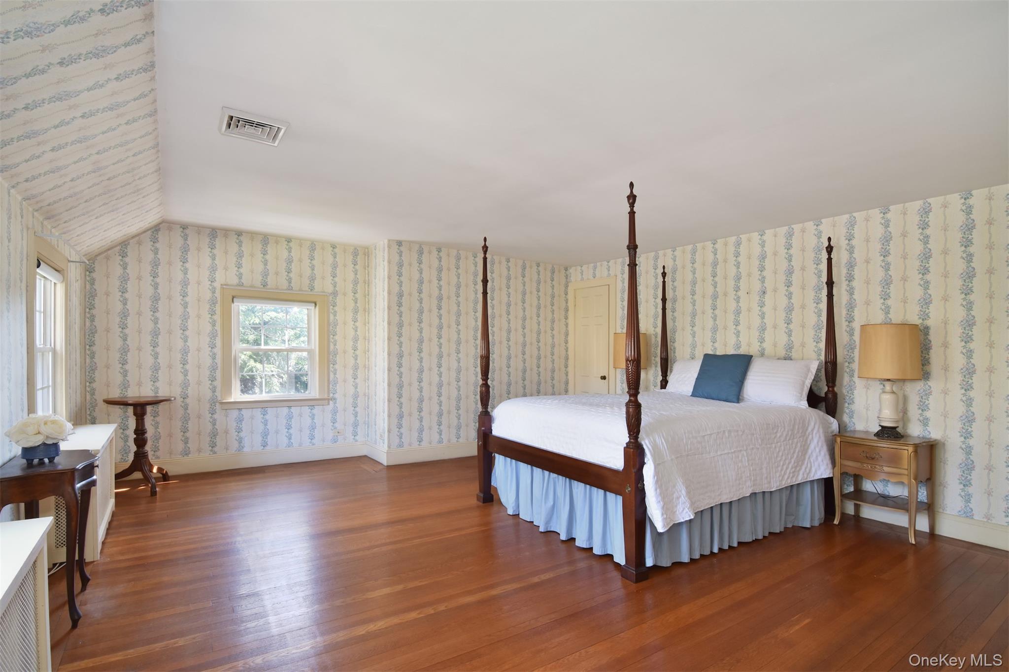 22 Burkewood Road Mount Vernon, NY 10552 - Photo 17 of 27 a spacious bedroom with a bed and wooden floor