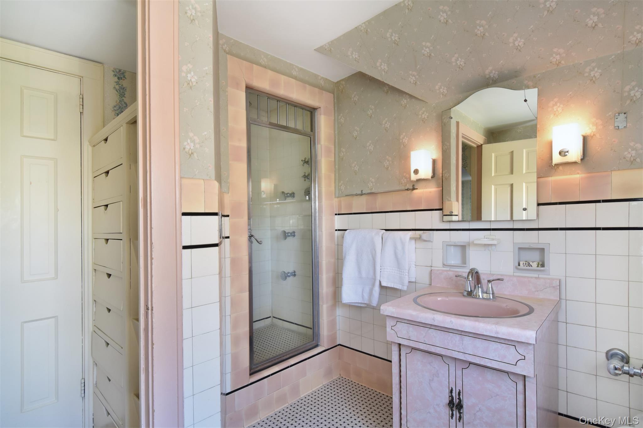 22 Burkewood Road Mount Vernon, NY 10552 - Photo 18 of 27 a bathroom with a sink a mirror and a shower