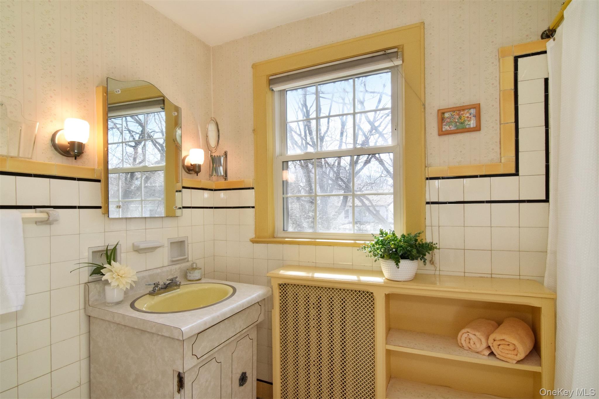 22 Burkewood Road Mount Vernon, NY 10552 - Photo 20 of 27 a bathroom with a sink and a mirror