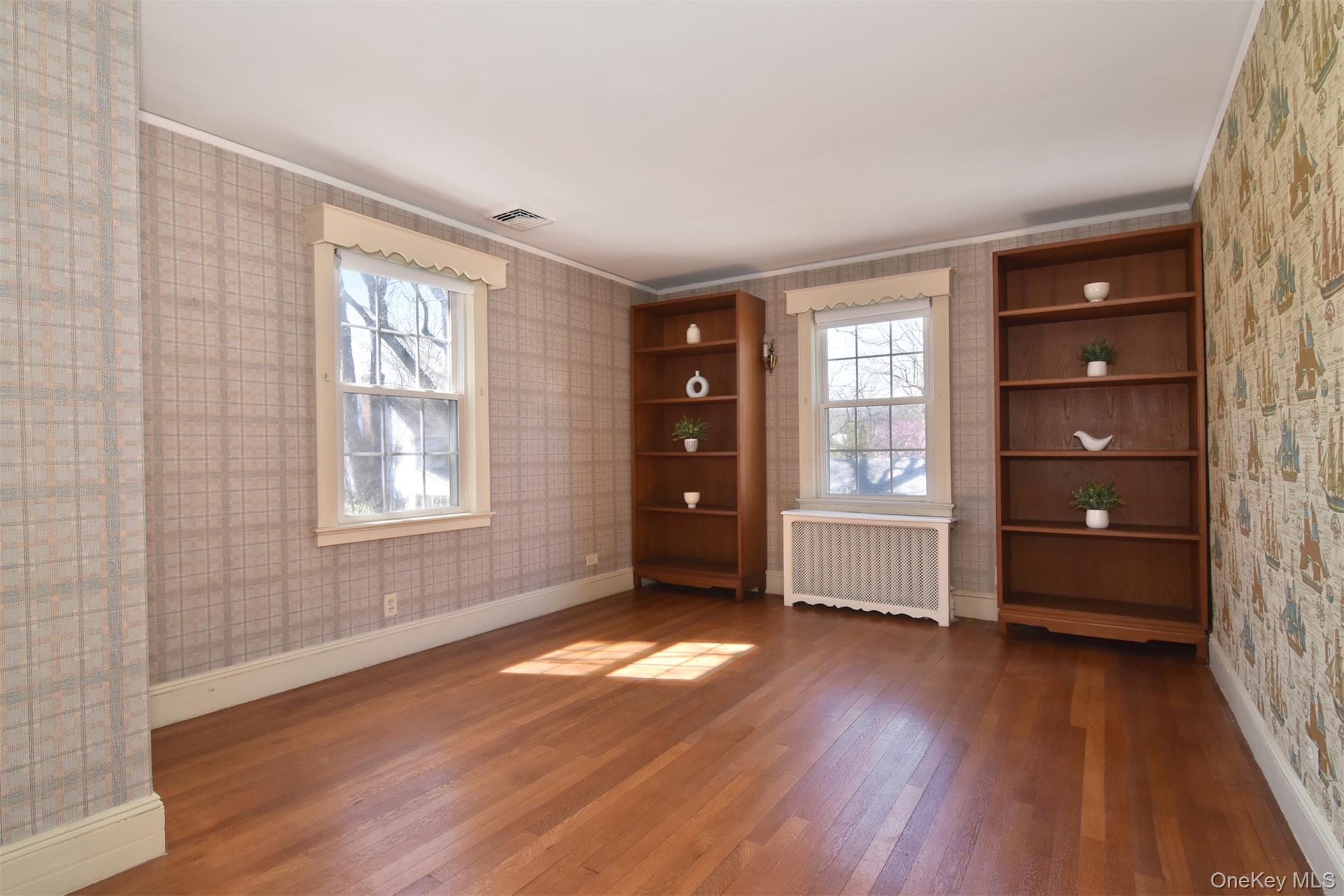 22 Burkewood Road Mount Vernon, NY 10552 - Photo 22 of 27 wooden floor in an empty room with a window