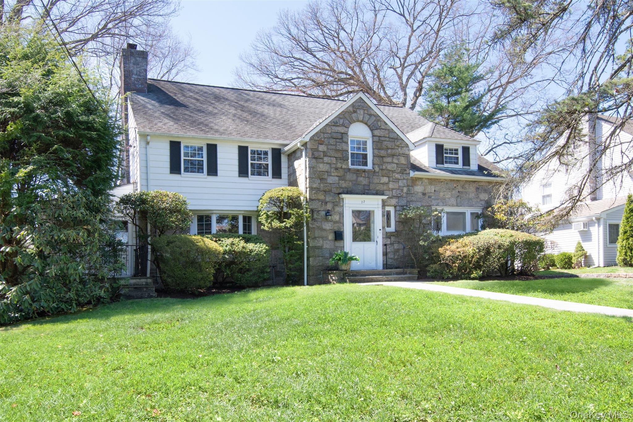22 Burkewood Road Mount Vernon, NY 10552 - Photo 27 of 27 a front view of a house with a garden and yard