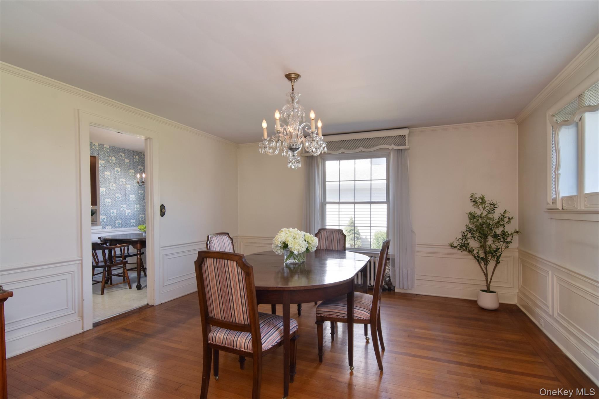 22 Burkewood Road Mount Vernon, NY 10552 - Photo 7 of 27 a dining room with furniture potted plants and wooden floor