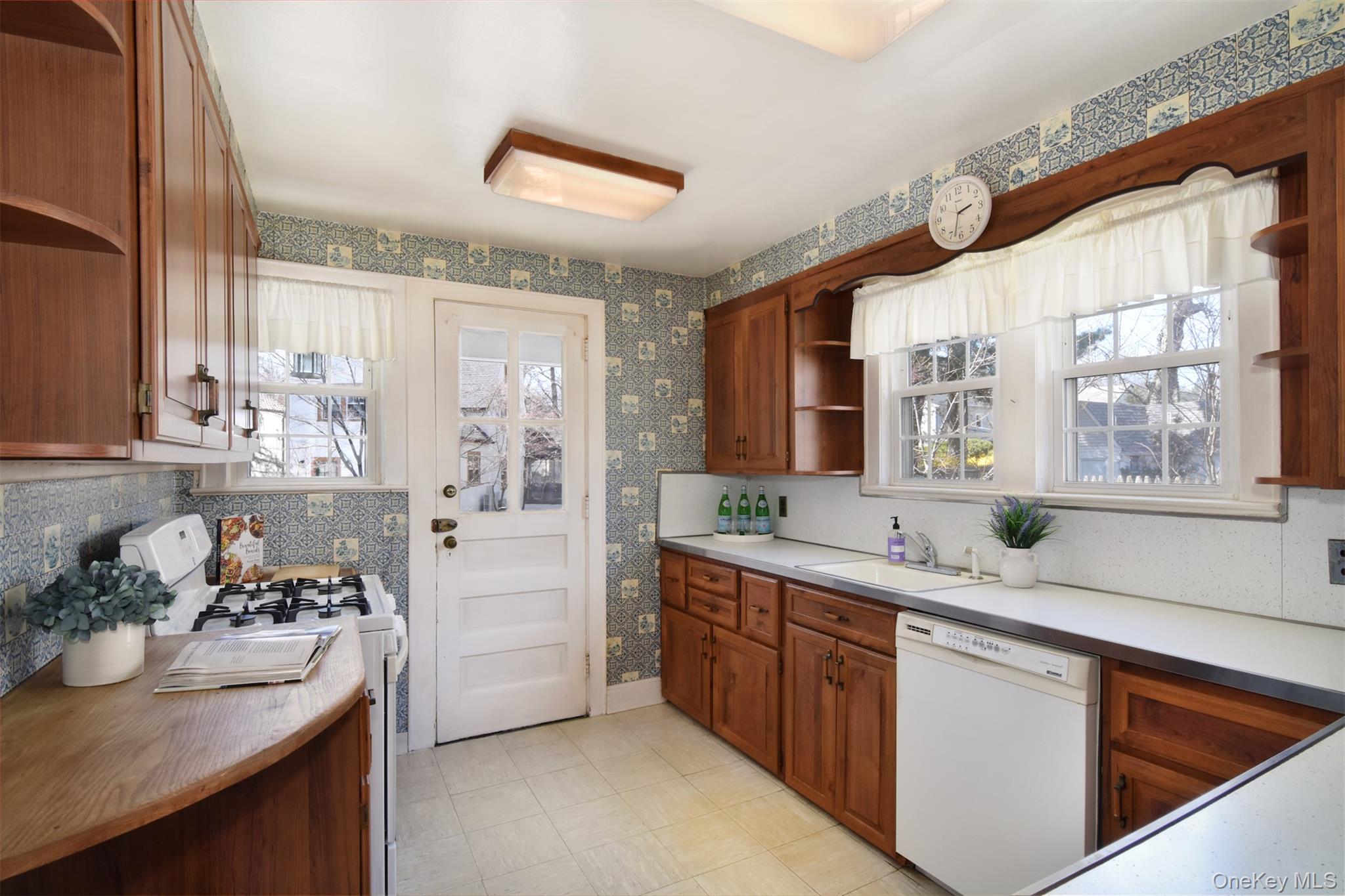 22 Burkewood Road Mount Vernon, NY 10552 - Photo 10 of 27 a kitchen with stainless steel appliances granite countertop a sink stove and cabinets