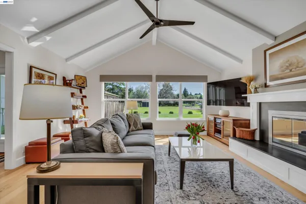 a kitchen with stainless steel appliances granite countertop a sink and a stove