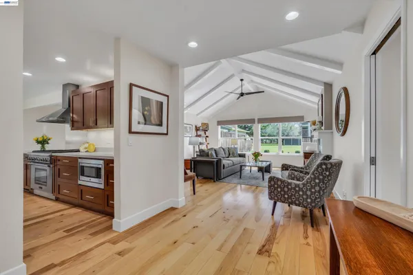 a kitchen with stainless steel appliances granite countertop a sink stove and cabinets