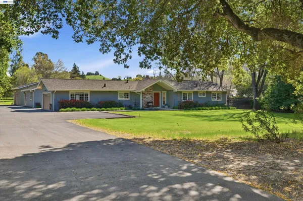a view of house with outdoor space and street view
