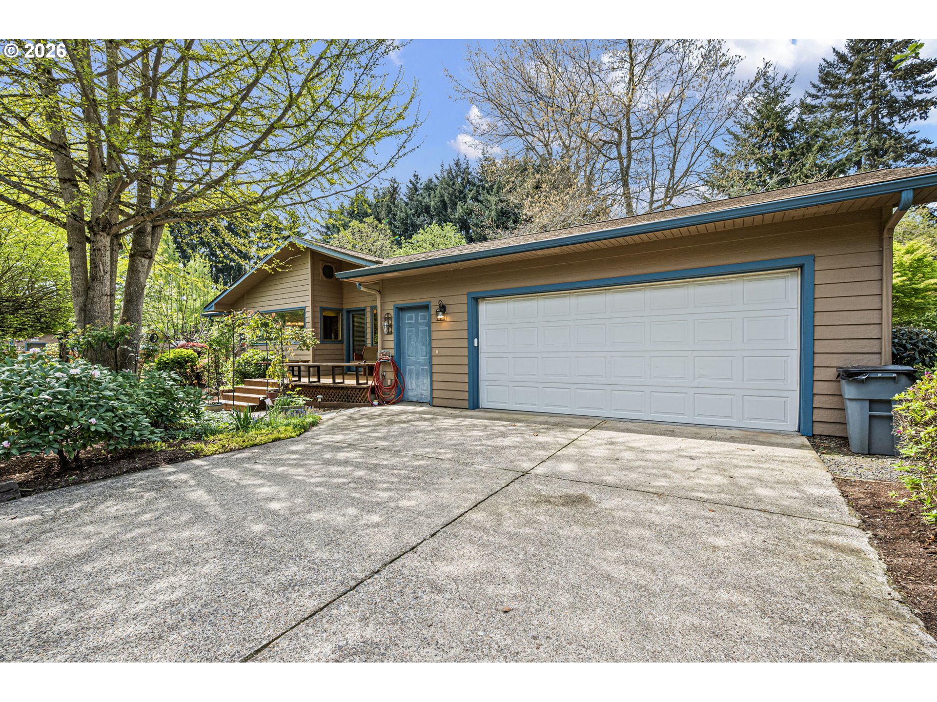 84 Green Lane Eugene, OR 97404 - Photo 4 of 41 a front view of a house with a yard and garage
