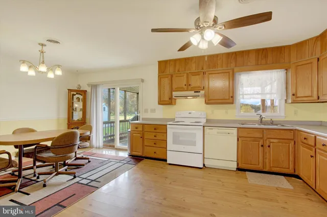 a kitchen with sink cabinets and window