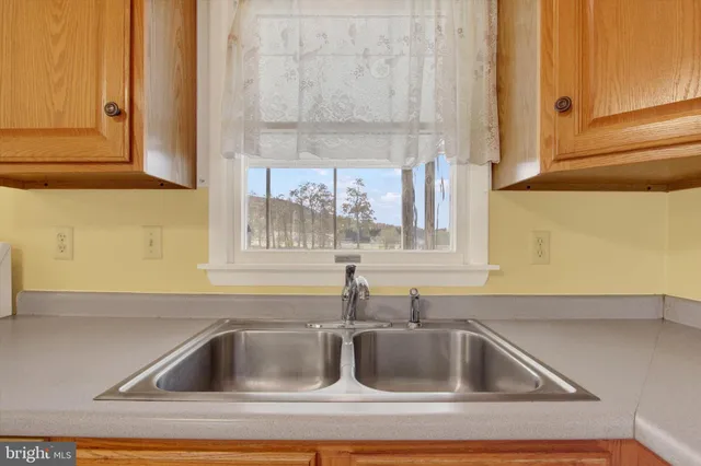 a kitchen with a sink and cabinets
