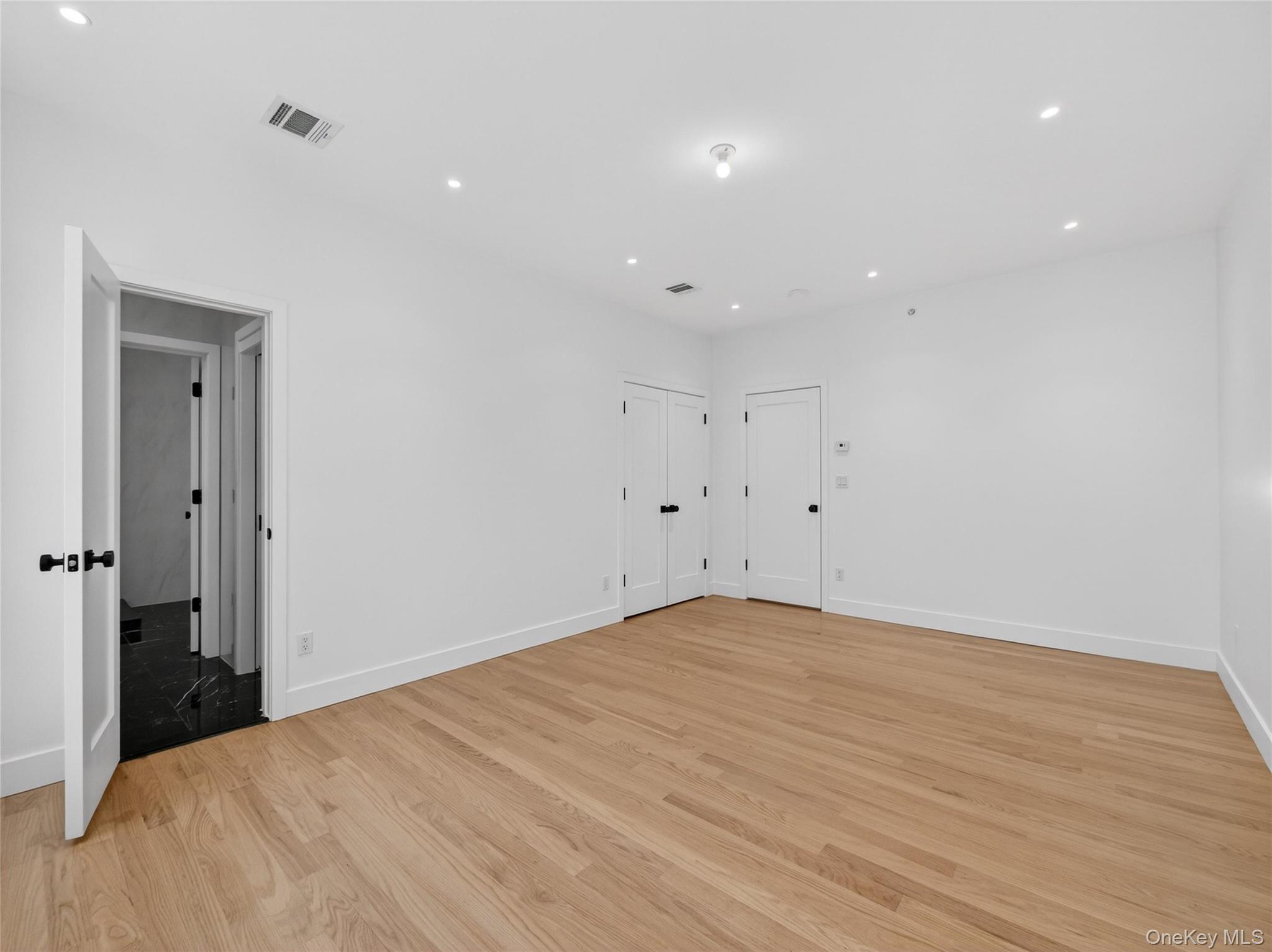 13 Elener Lane, Unit 202 Spring Valley, NY 10977 - Photo 14 of 48 a view of room with wooden floor and window