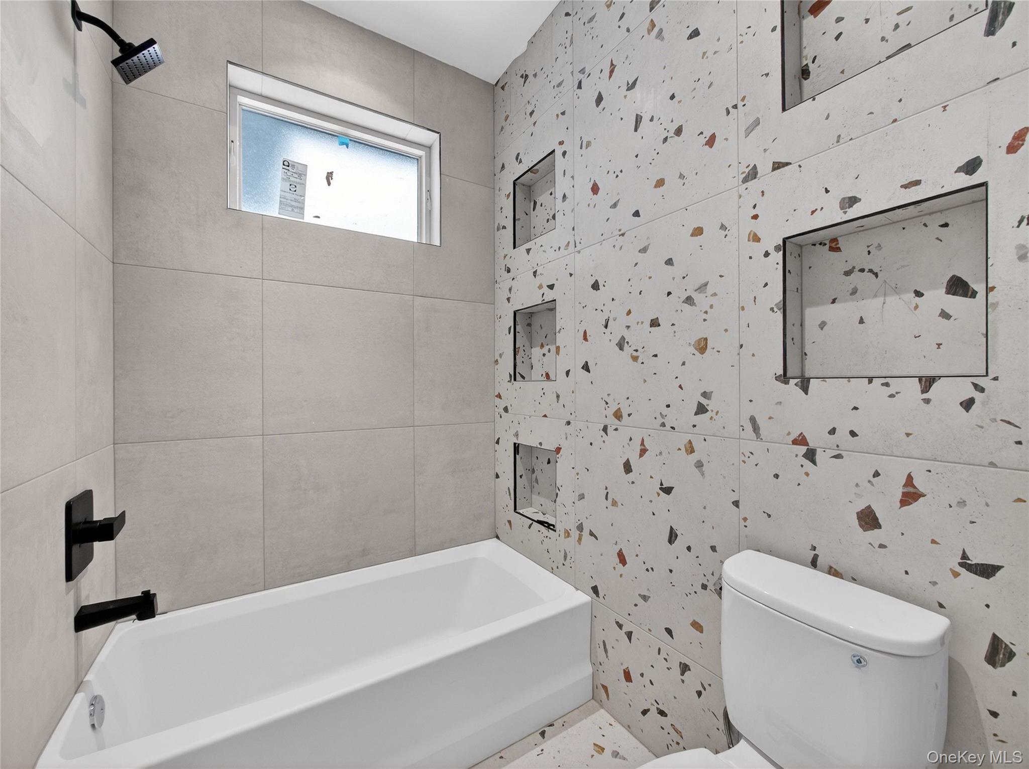 13 Elener Lane, Unit 202 Spring Valley, NY 10977 - Photo 23 of 48 a bathroom with a toilet and a bathtub