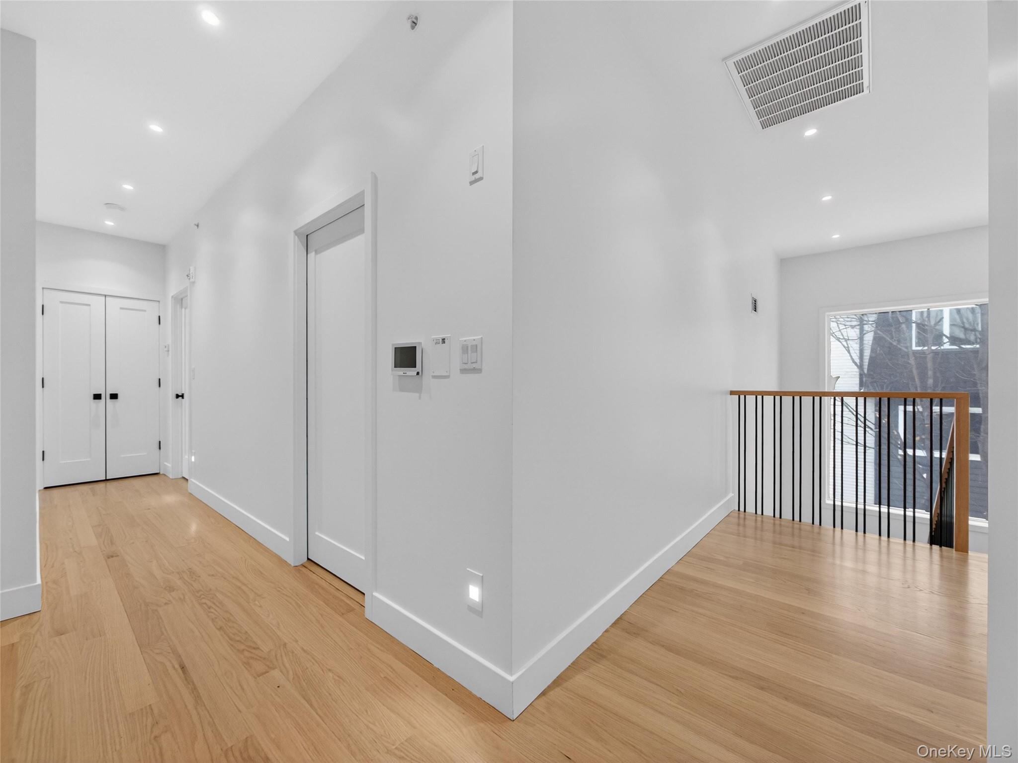 13 Elener Lane, Unit 202 Spring Valley, NY 10977 - Photo 25 of 48 a view of a hallway with wooden floor