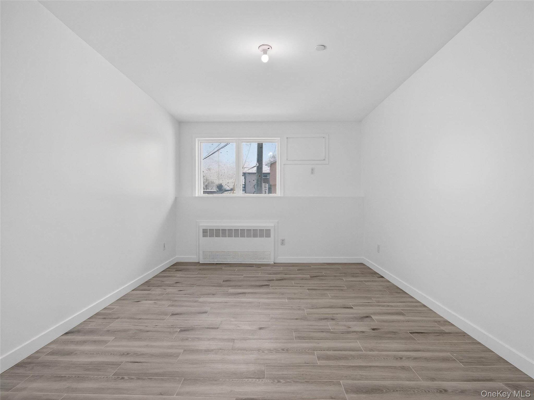 13 Elener Lane, Unit 202 Spring Valley, NY 10977 - Photo 39 of 48 wooden floor in a empty room