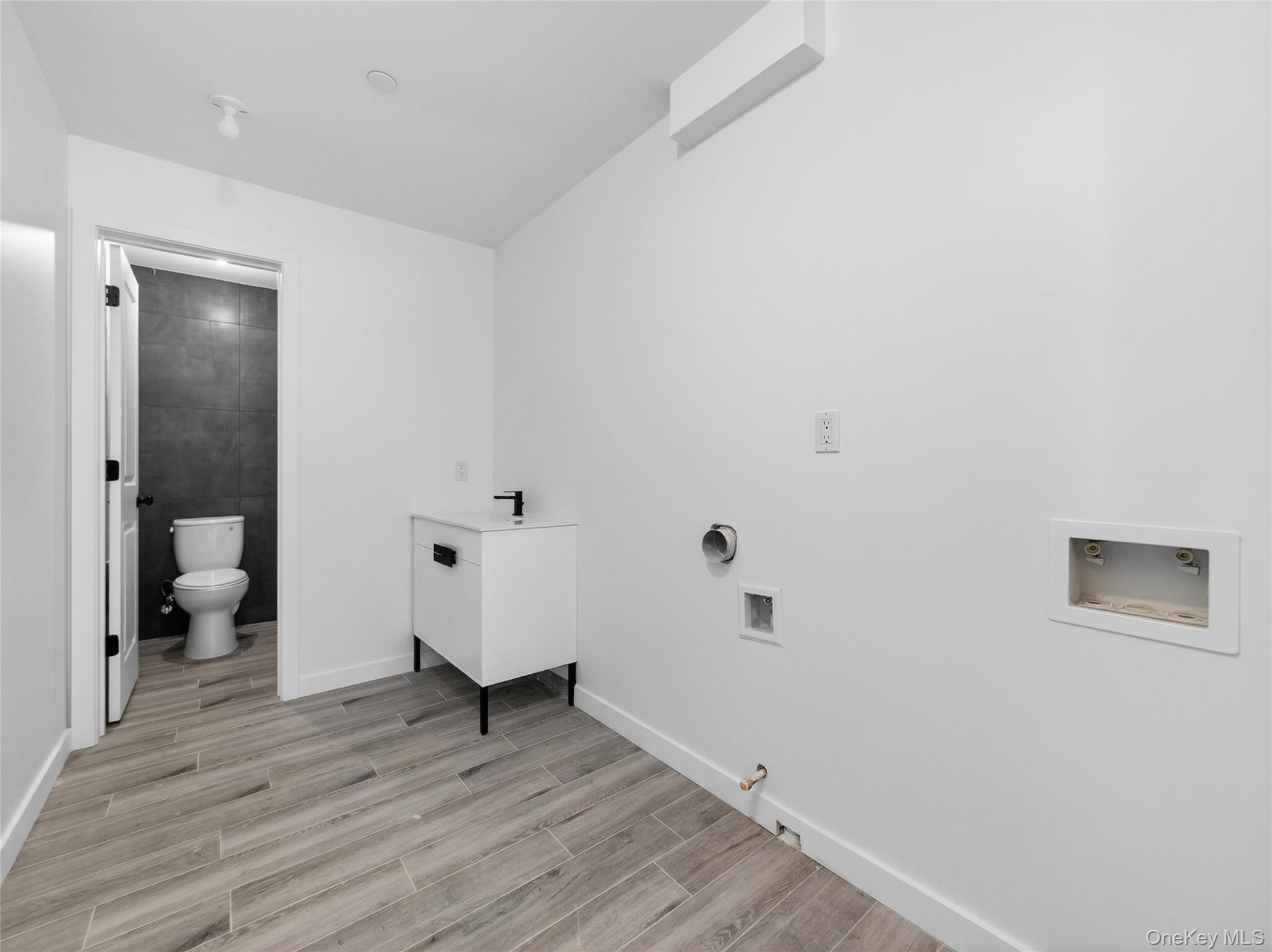 13 Elener Lane, Unit 202 Spring Valley, NY 10977 - Photo 40 of 48 a view of a room with wooden floor