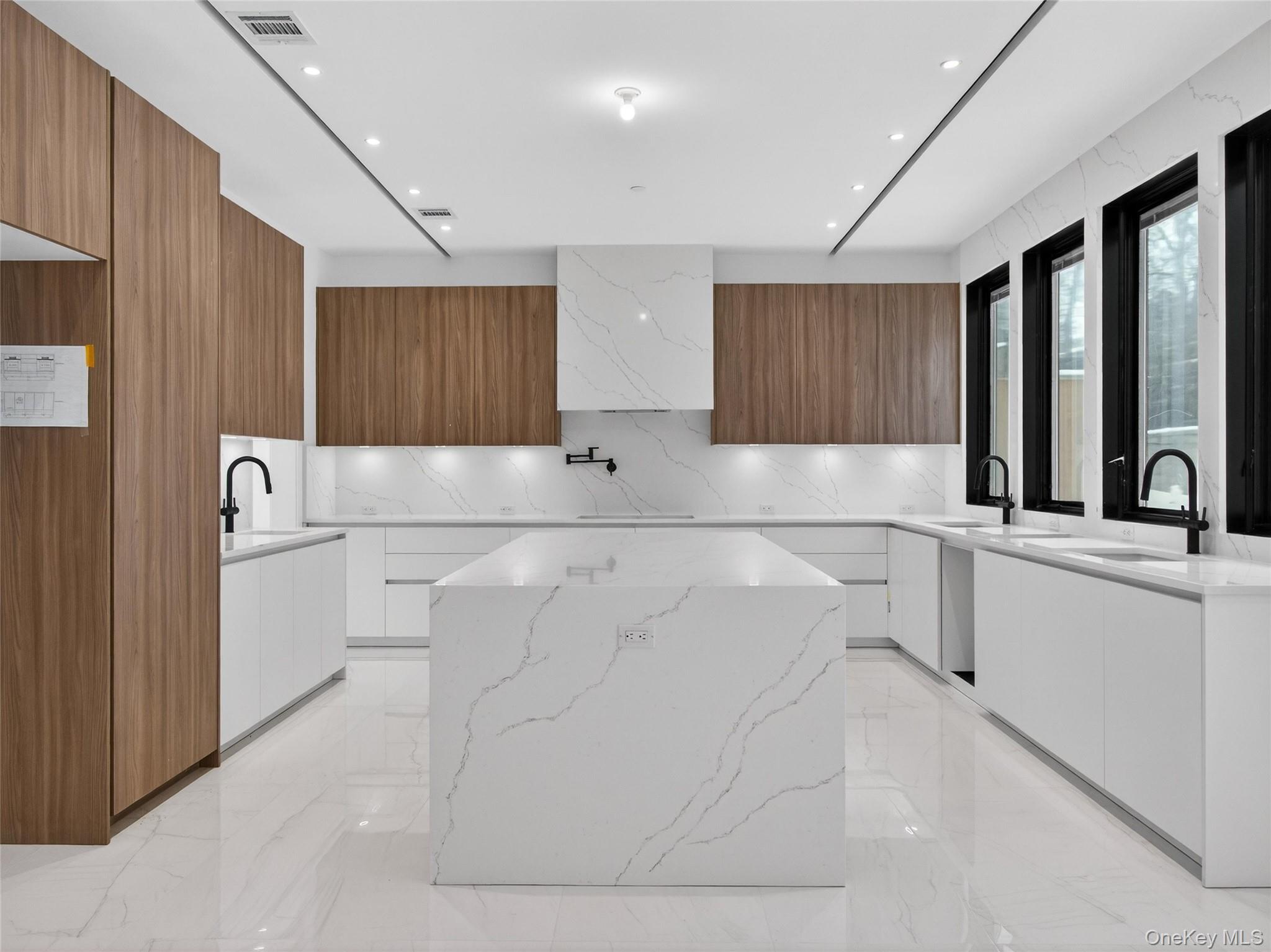 13 Elener Lane, Unit 202 Spring Valley, NY 10977 - Photo 8 of 48 a kitchen with a sink and cabinets