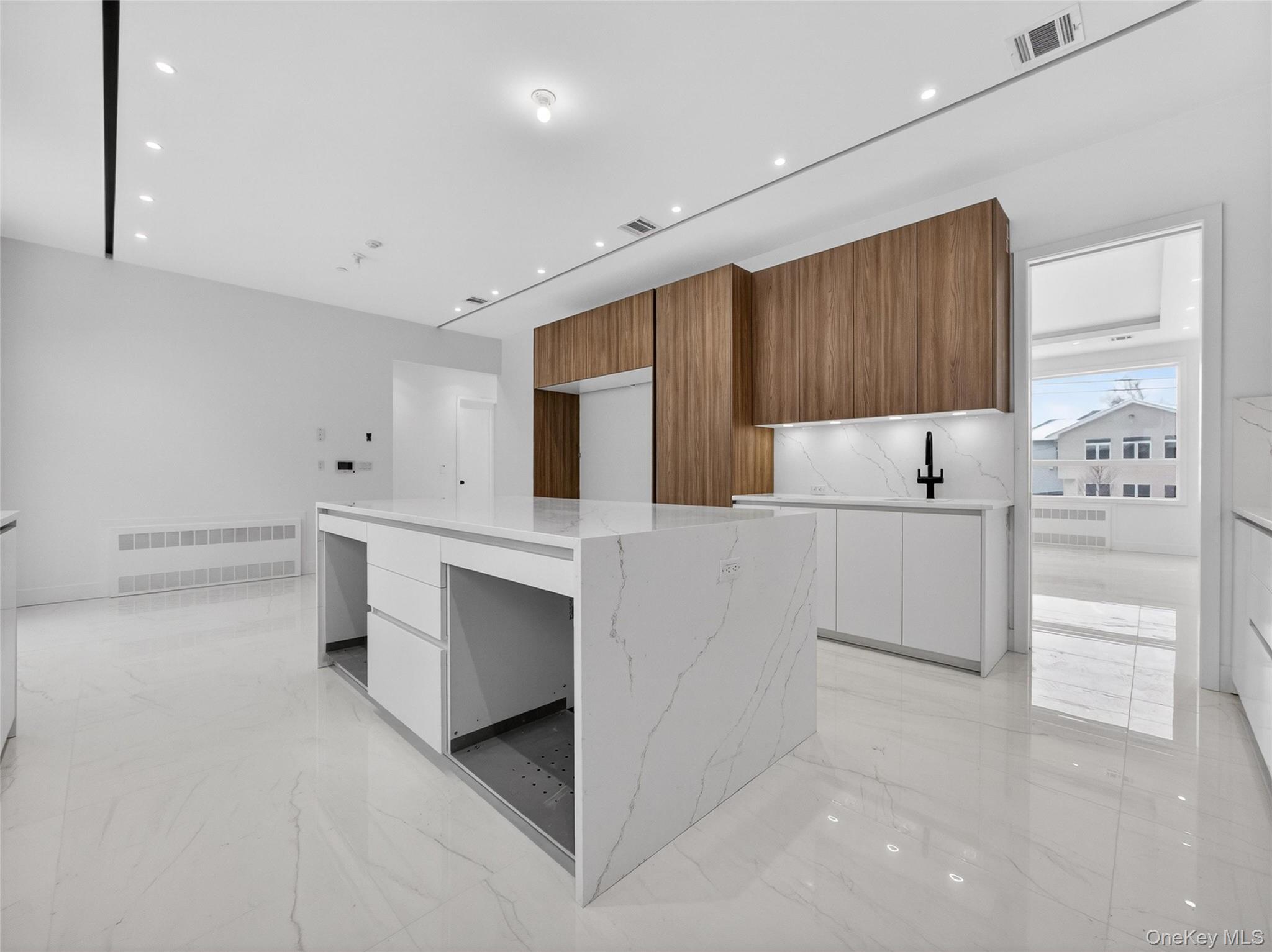 13 Elener Lane, Unit 202 Spring Valley, NY 10977 - Photo 10 of 48 a kitchen with white cabinets