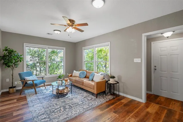 a living room with furniture and a large window