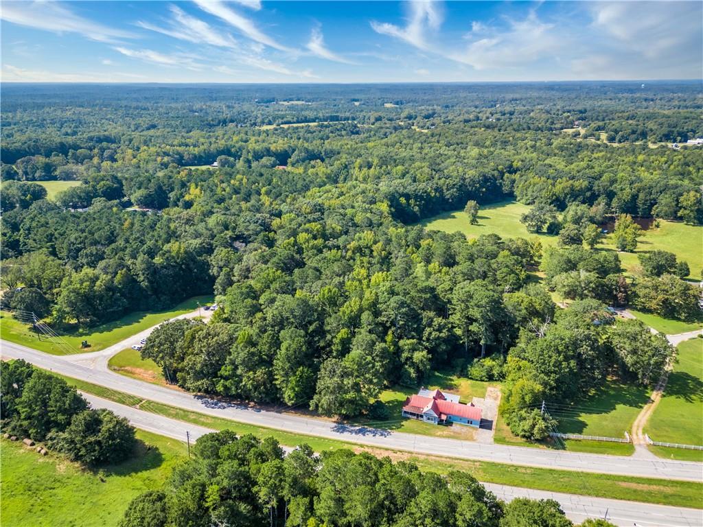 2020 Highway 78 Monroe, GA 30655 - Photo 1 of 10 an aerial view of residential houses with outdoor space and trees