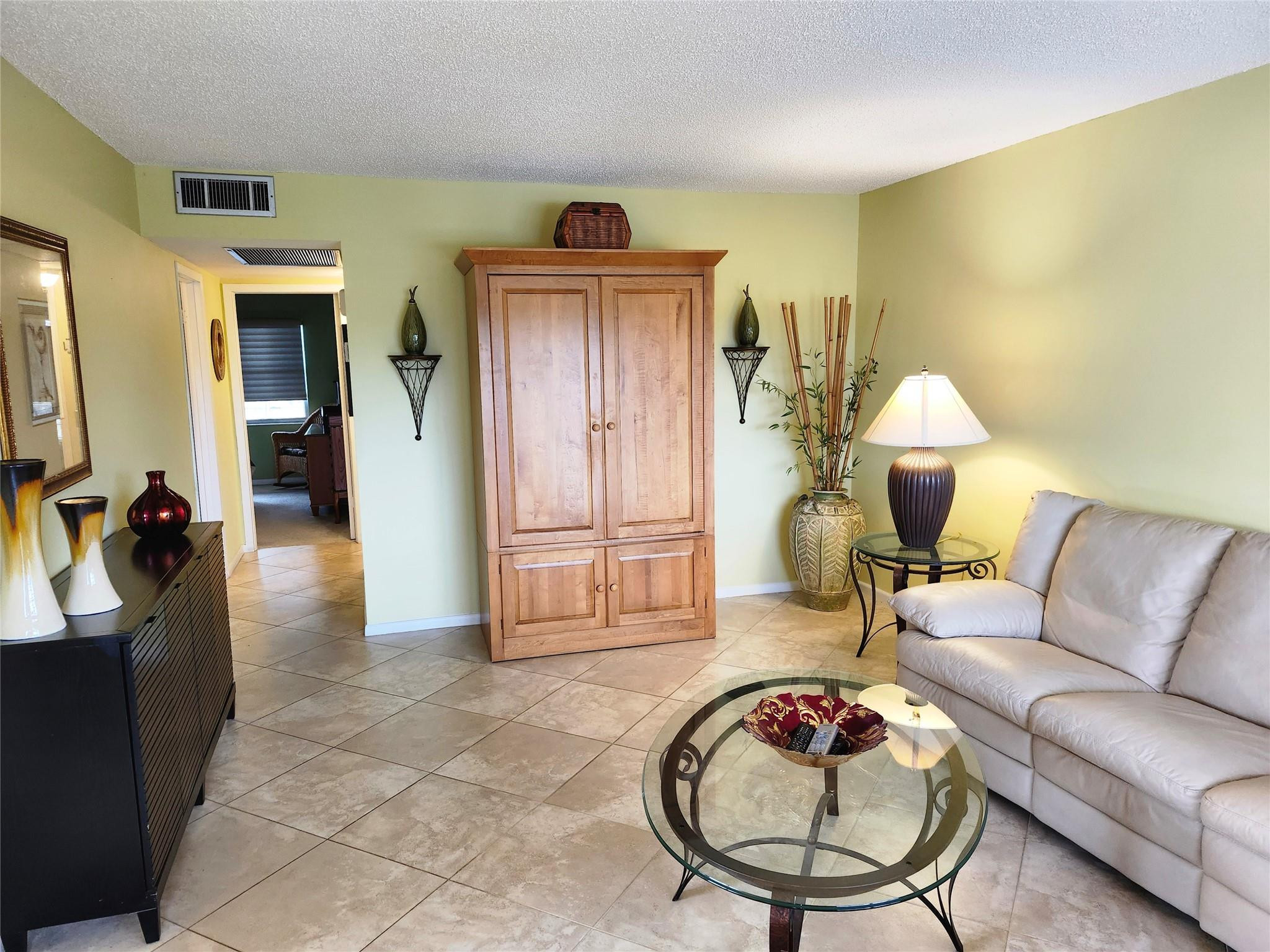 74 Preston Way Boca Raton, FL 33434 - Photo 4 of 28 a living room with furniture and a wooden floor