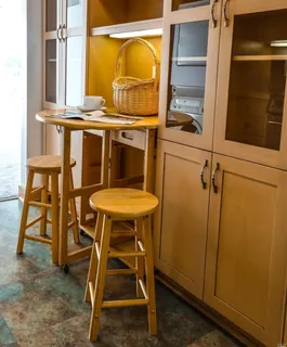 a view of chair and table in the room