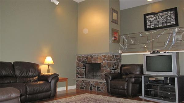 27 Brook Road Marblehead, MA 01945 - Photo 9 of 22 a living room with furniture a flat screen tv and a fireplace
