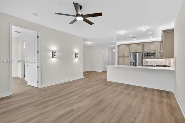 a view of kitchen with wooden floor and window