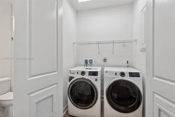 a view of washer and dryer in a utility room