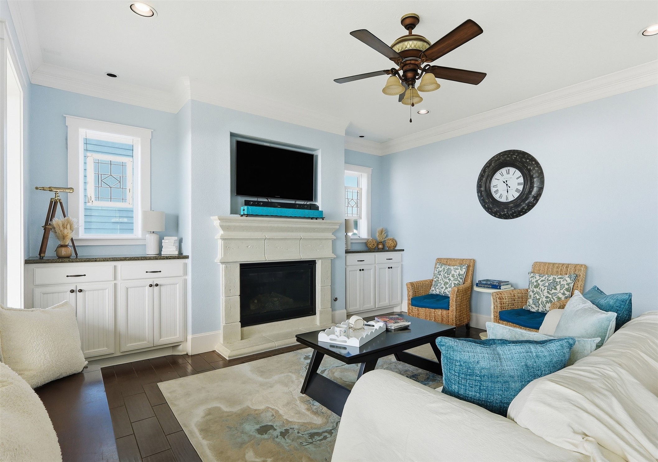 11622 Beachside Galveston, TX 77554 - Photo 2 of 39 This cozy living room features a welcoming fireplace, and built-in cabinets.