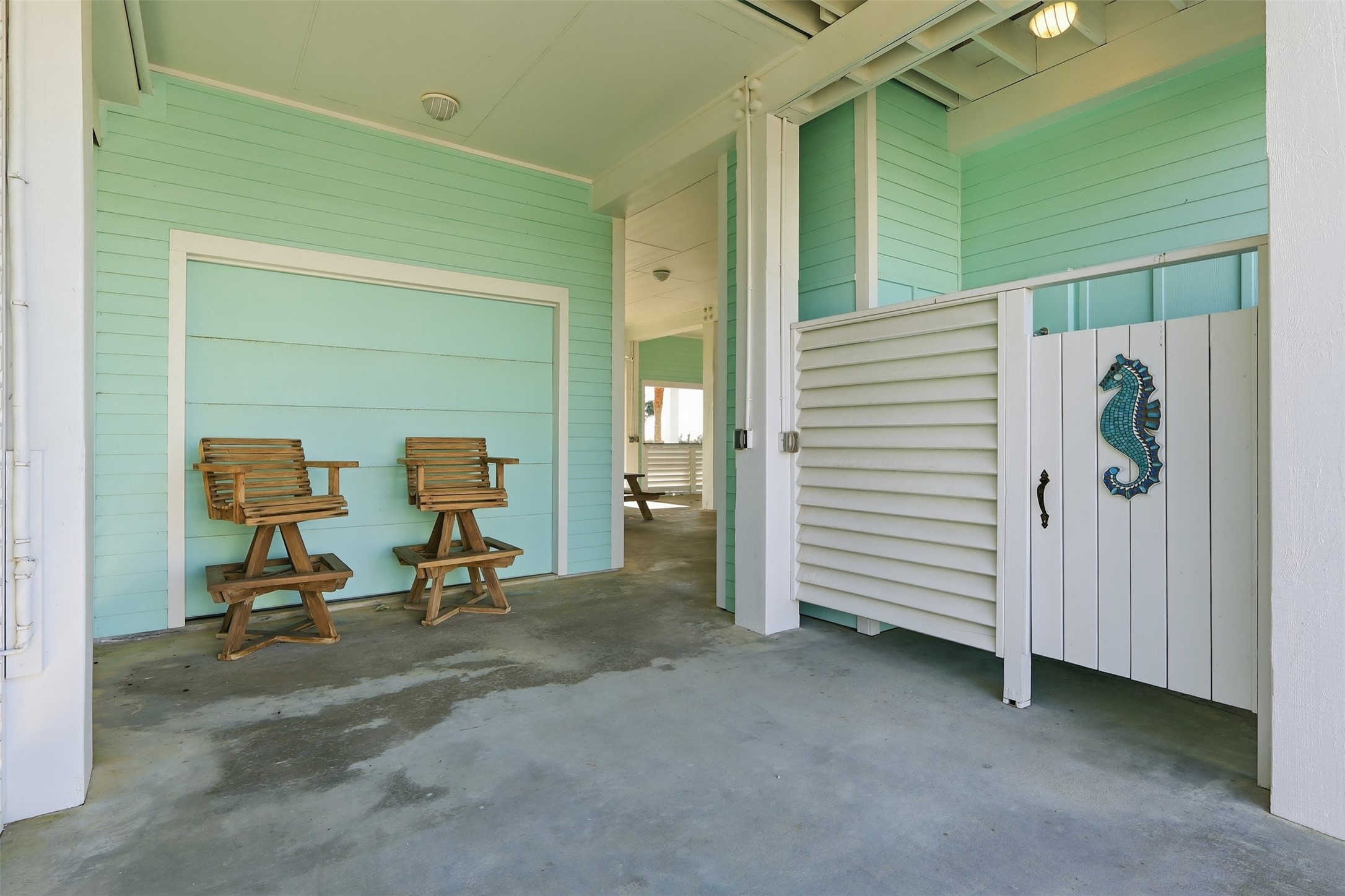 11622 Beachside Galveston, TX 77554 - Photo 31 of 39 A charming covered patio area with an outdoor shower.