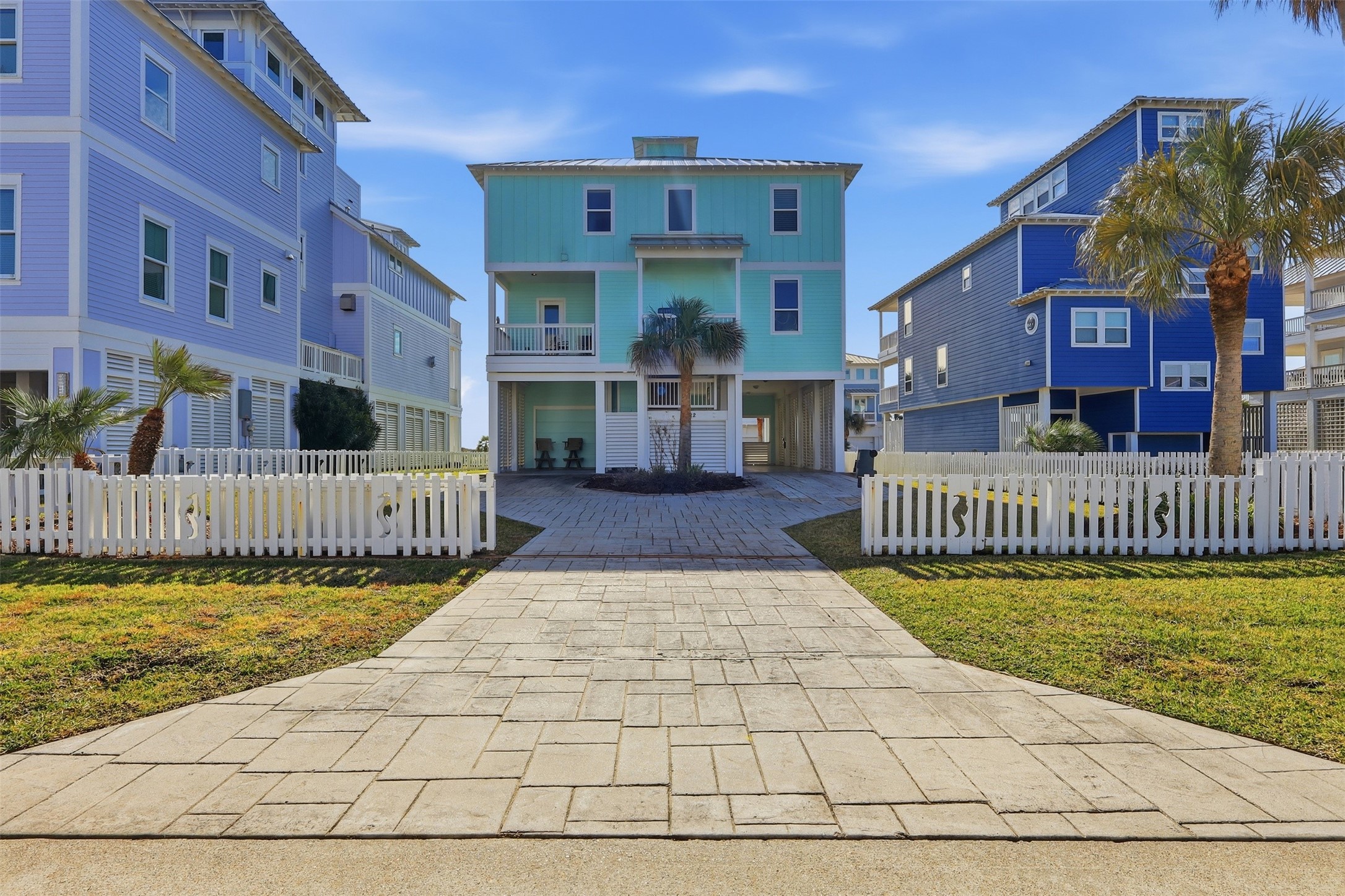 11622 Beachside Galveston, TX 77554 - Photo 33 of 39 A vibrant beach-style home featuring multiple levels and a spacious balcony.
