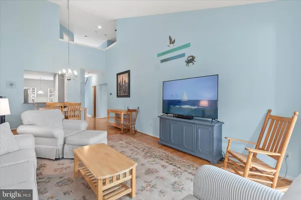 a living room with furniture window and a fireplace
