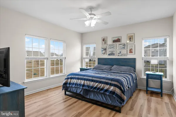 a bedroom with a bed and flat screen tv