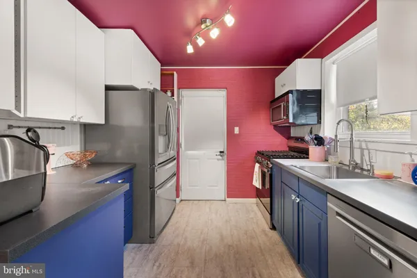 a kitchen with a stove and a microwave