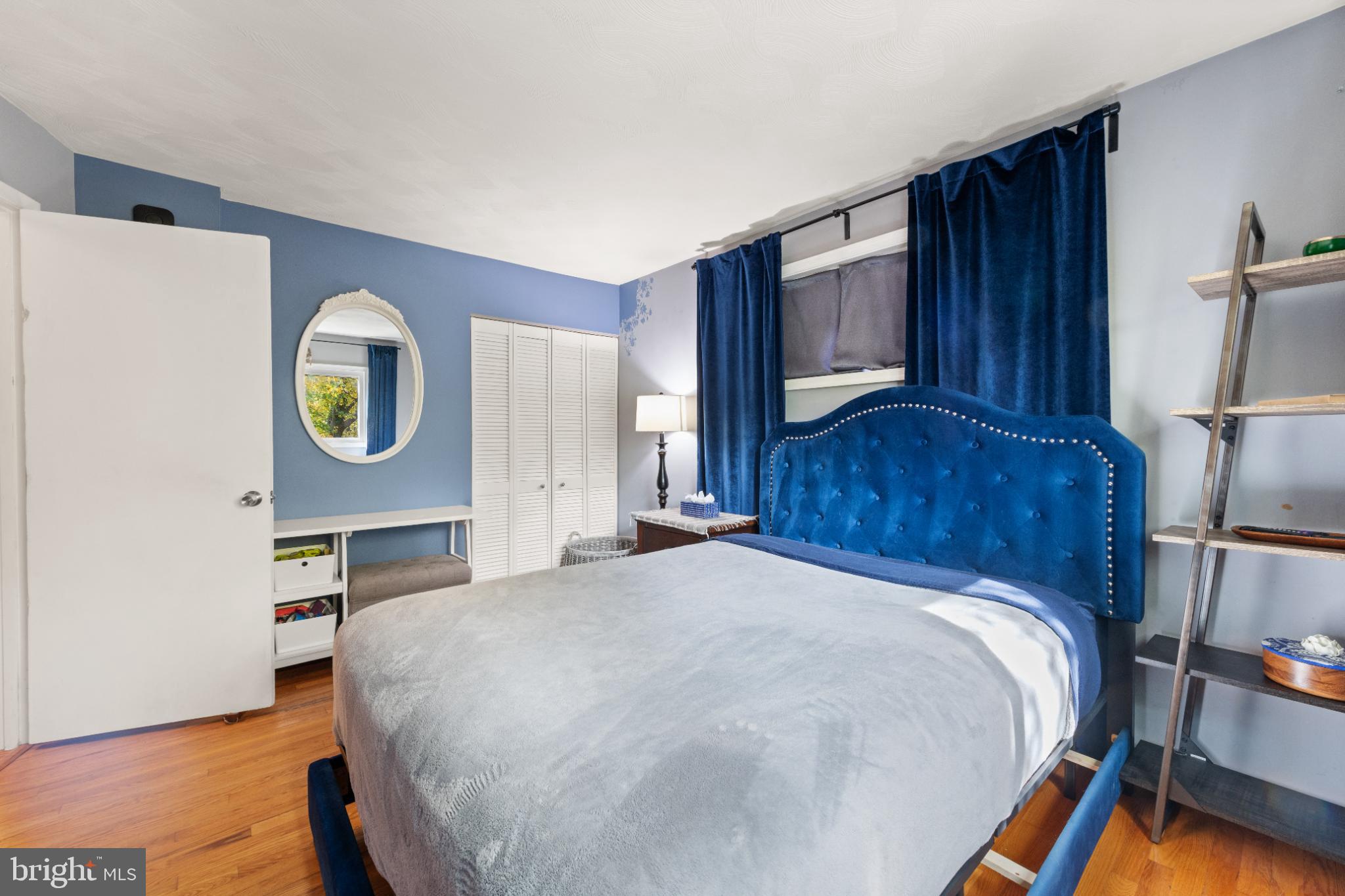 3700 Ralph Road Silver Spring, MD 20906 - Photo 20 of 30 a bed sitting in a bedroom next to a window