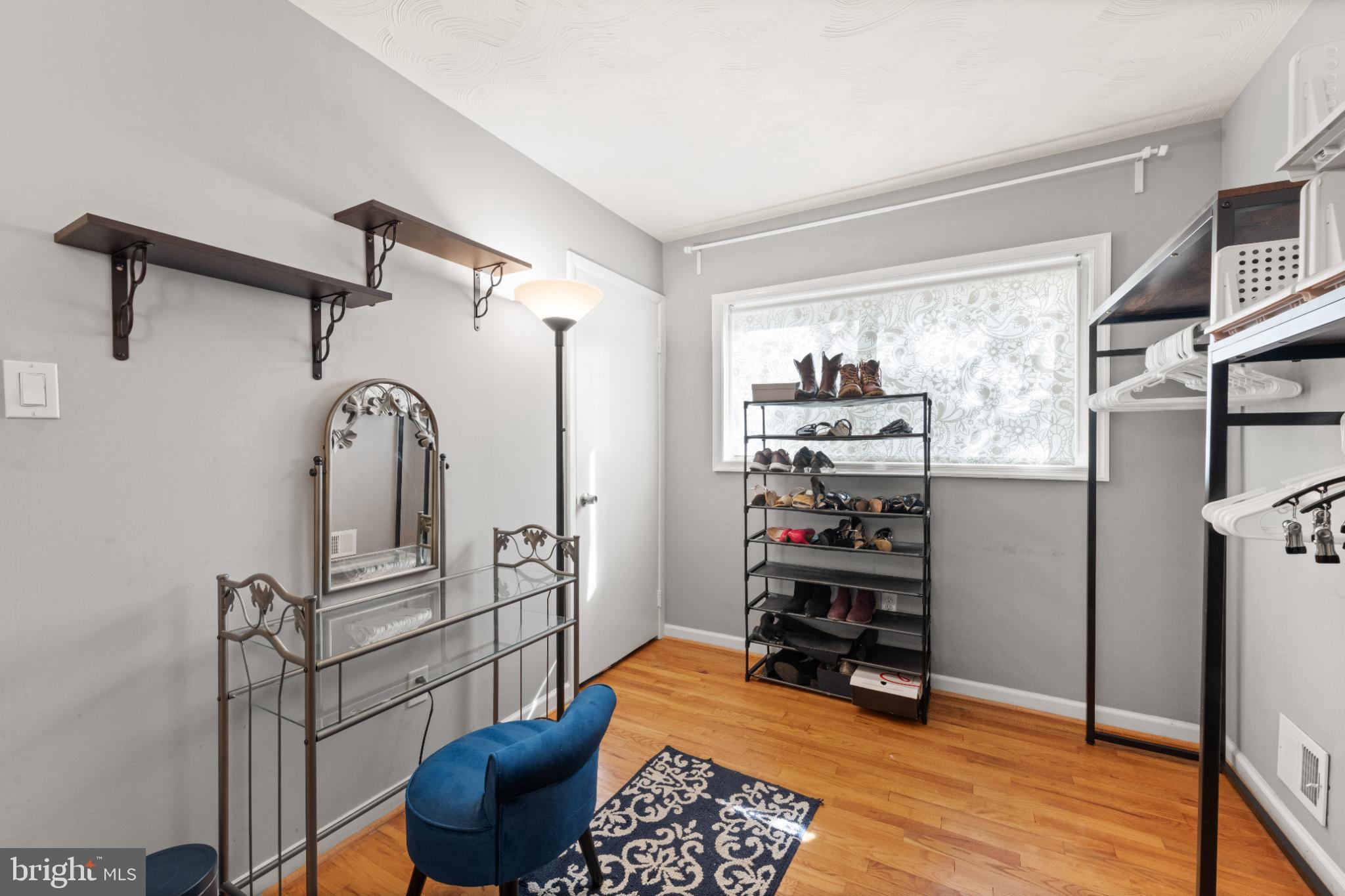 3700 Ralph Road Silver Spring, MD 20906 - Photo 24 of 30 a bedroom with furniture and a wooden floor