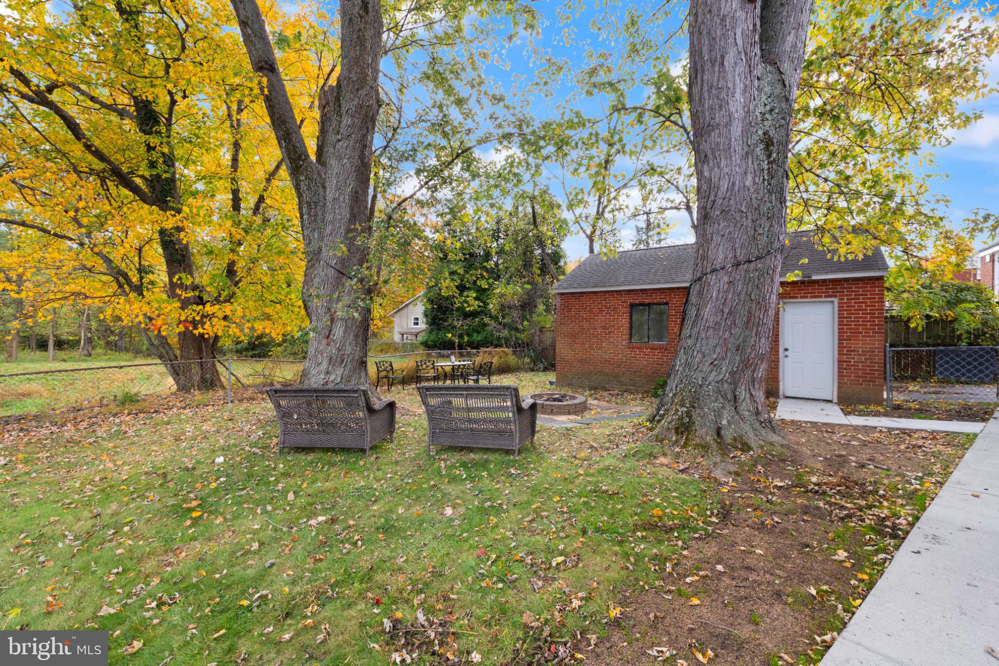 3700 Ralph Road Silver Spring, MD 20906 - Photo 29 of 30 a backyard of a house with table and chairs