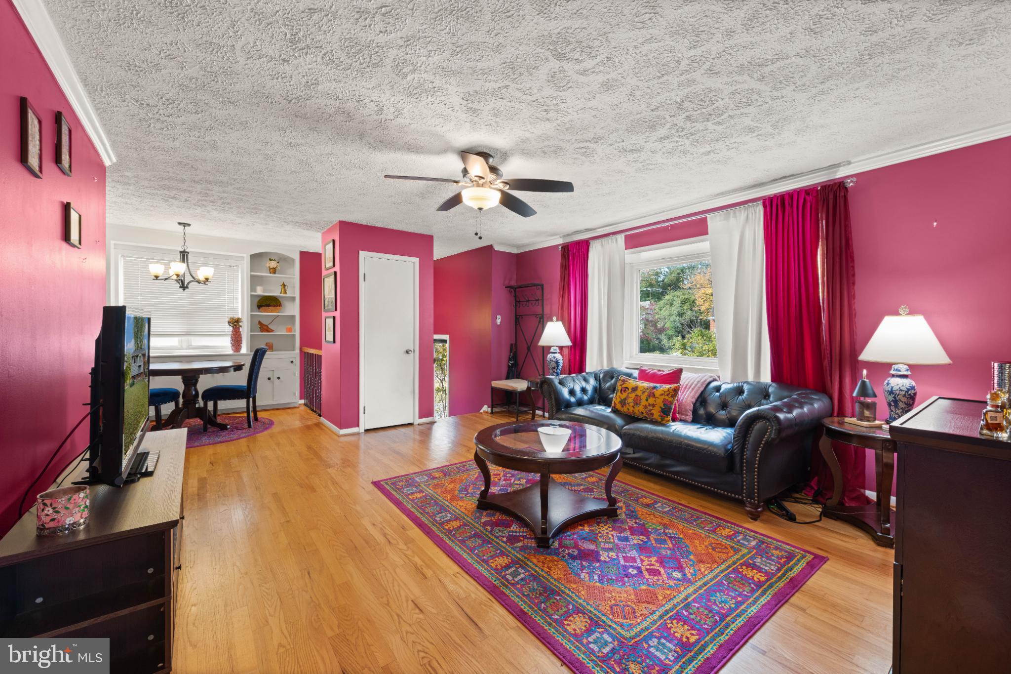 3700 Ralph Road Silver Spring, MD 20906 - Photo 10 of 30 a living room with furniture and a chandelier