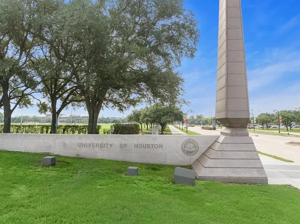 a view of outdoor space with garden and trees